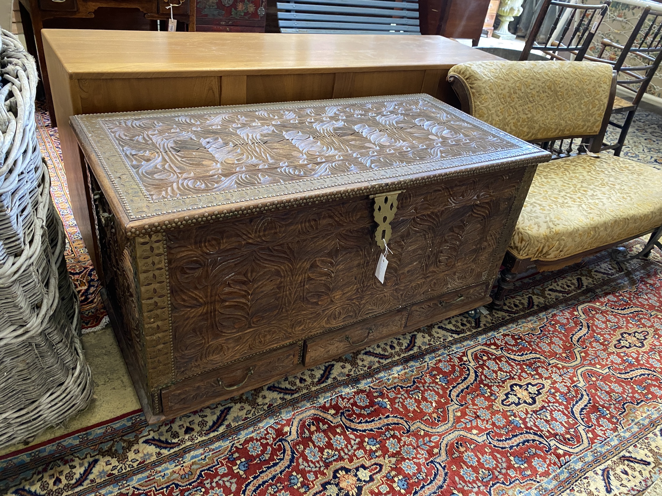 A brass mounted carved hardwood Zanzibar chest, width 110cm, depth 54cm, height 61cm